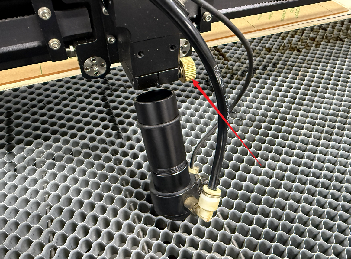 Loosen screw to remove laser lens barrel