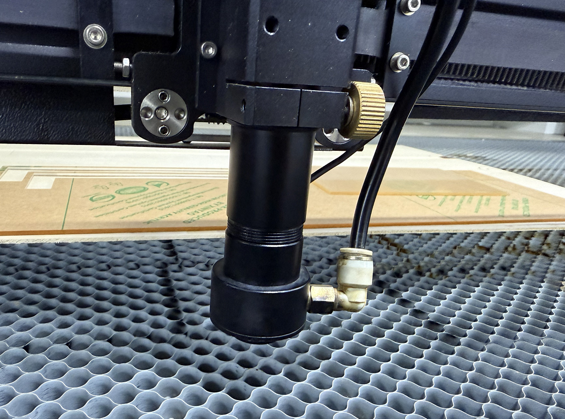 Reinstall and tighten the laser lens barrel