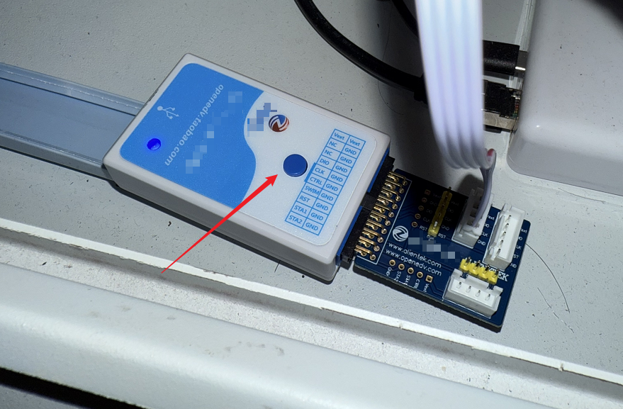 Pressing the Mini-pro programmer button to start firmware write