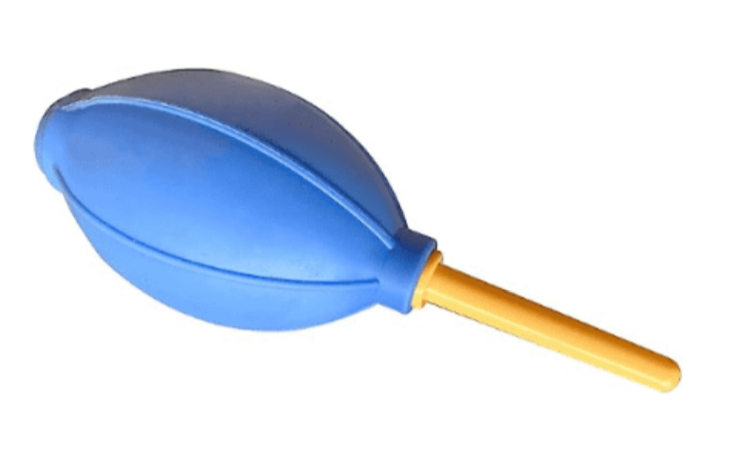 Blowing compressed air on the Hydra Series laser lens