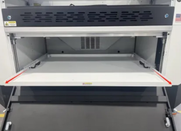 Removing the waste hopper tray for debris disposal