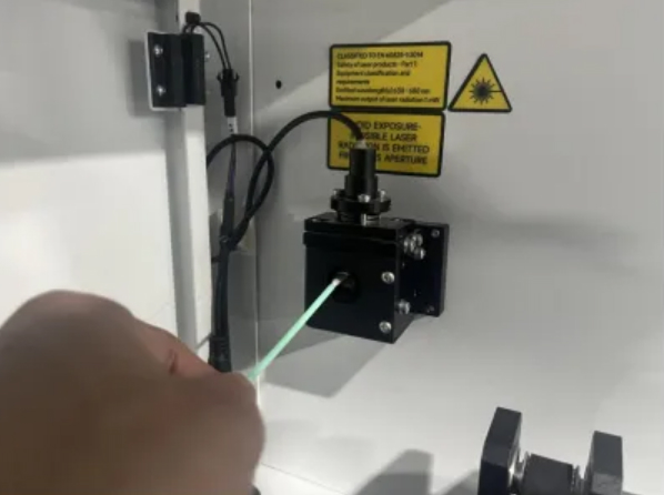 Close-up of the laser beam combiner component