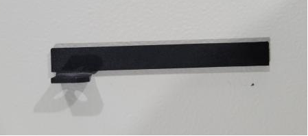 Linear rail limit plate for laser head assembly