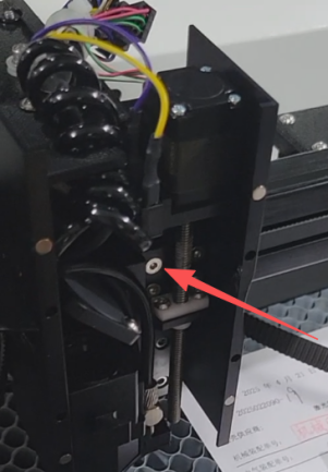 Loosening internal screws inside laser head assembly