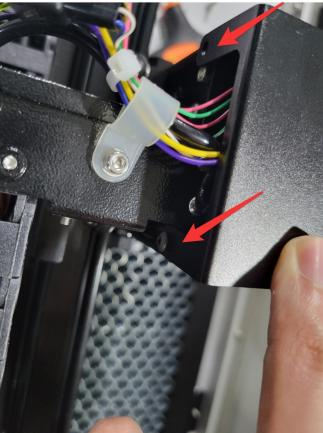 Loosening screws on the back of the laser head top cover