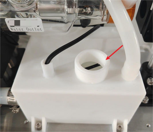 Pouring pure water into OneLaser XT chiller reservoir