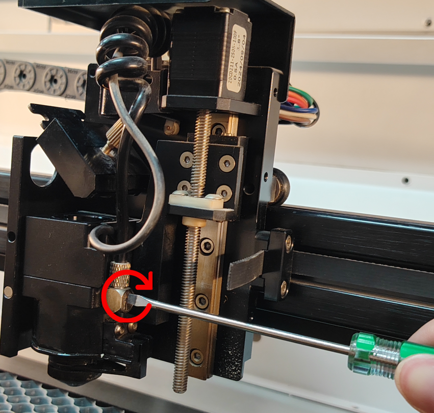 Adjusting air pipe screw with flat head screwdriver