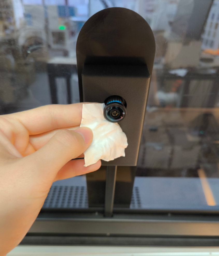 Cleaning the OneLaser camera lens to improve accuracy