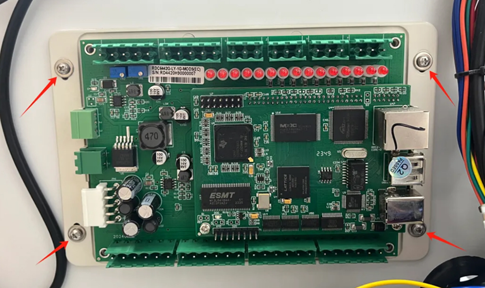 Removing screws securing laser control board