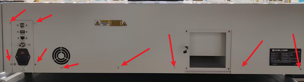 Removing rear cover screws from laser machine enclosure