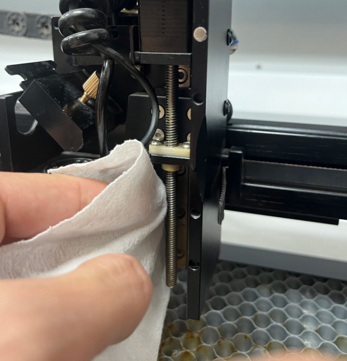 Wipe the screw rod with a dry cloth to remove dirt