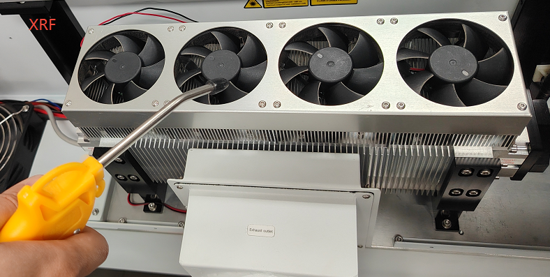 Blowing dust off the X Series cooling fan with an air gun