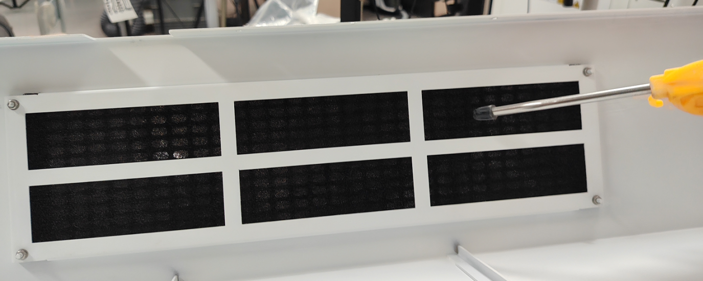 Cleaning dust filter cotton on the rear cover of the X Series laser