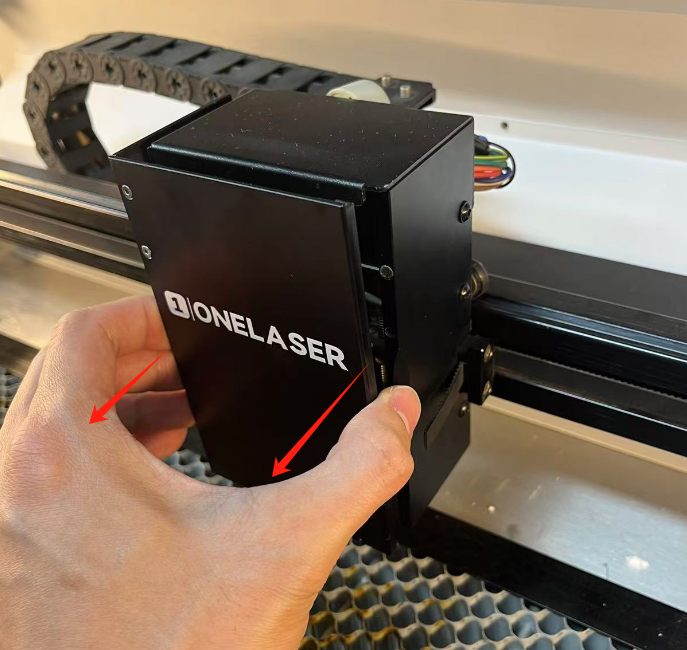 Removing the X Series laser focus lens housing