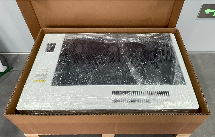 Removing carton packaging and placing OneLaser X Series on workbench