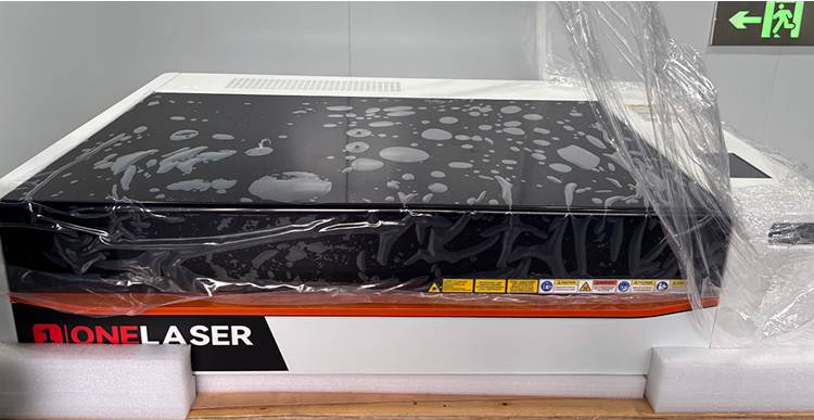 Peeling off protective film from OneLaser X Series machine
