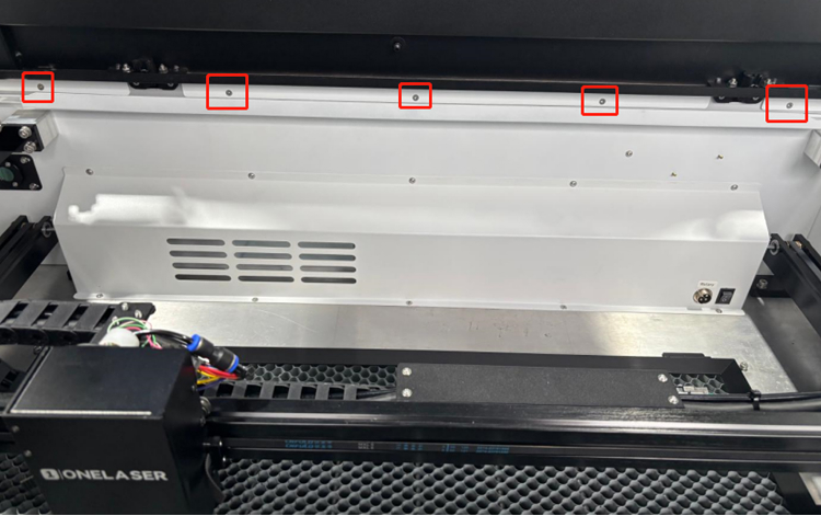 Removing screws to open back box of OneLaser X Series machine