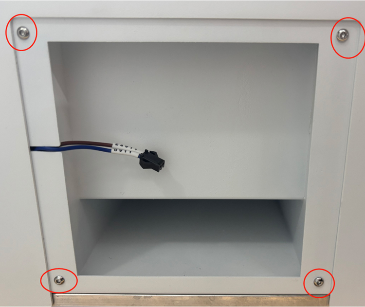 Removing screws to prepare OneLaser X Series exhaust outlet installation