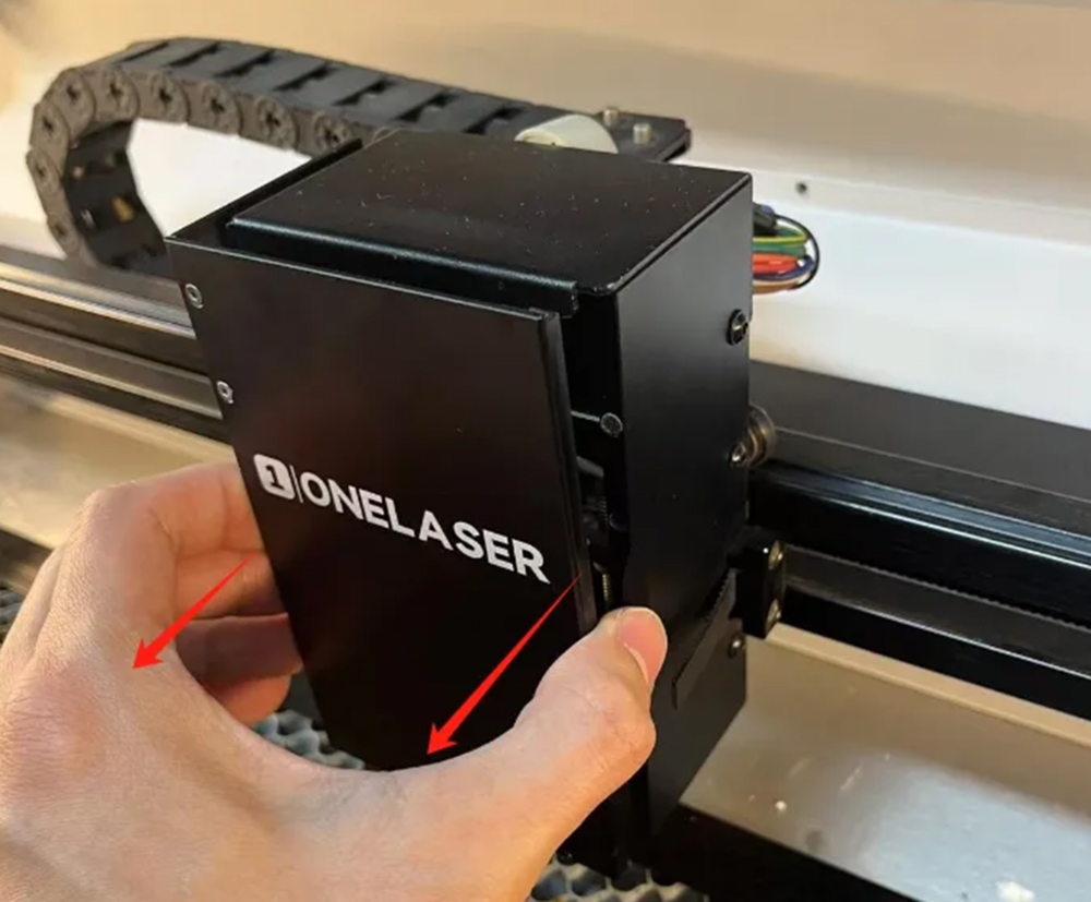 Removing the front cover of a laser engraving machine head